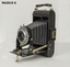 KODAK BROWNIE 620 Camera ANASTON black folding. Folds back into narrow case with handle.