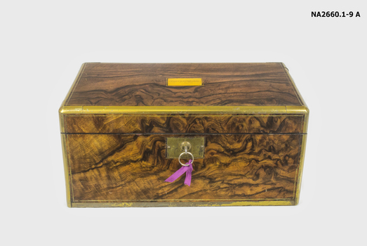 Walnut and brass fitted writing case bound with brass.