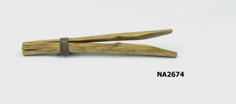 Wooden peg made from a semi-split twig 