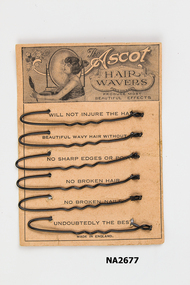 Peach coloured card of six 'Ascot Hair Wavers'