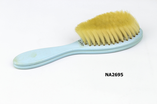 Small babies brush, pale blue plastic 