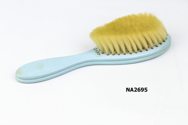 Small babies brush, pale blue plastic 
