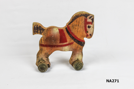 Toy wooden pull along horse