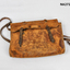 Brown leather school bag with shoulder straps