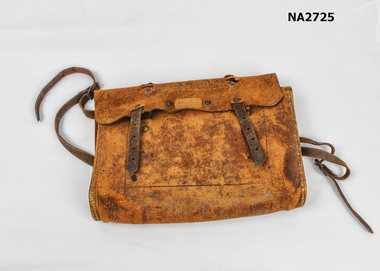 Brown leather school bag with shoulder straps