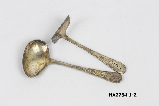 Silver baby's spoon with design engraved on handle, 