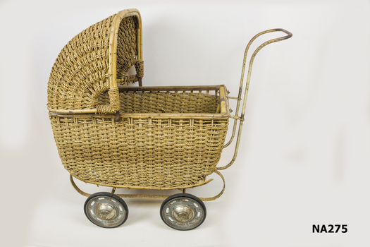 Woven cane pram 