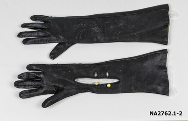 Pair of women's mid length pull on navy blue leather evening gloves. T