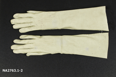 Pair of suede mid-length beige or fawn gloves 