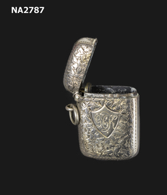 Small rectangular silver plated match case containing 4 waterproof wax matches.