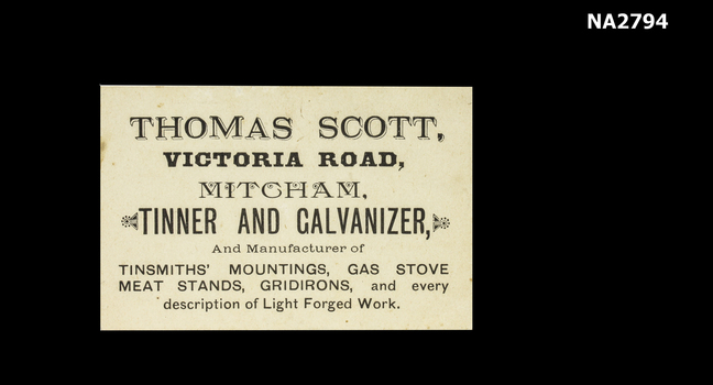 White business card printed in black.