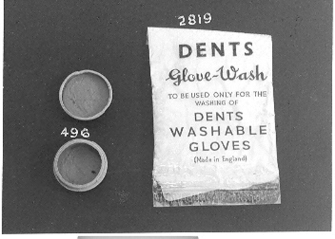 Small plastic bag containing cream coloured substance with washing instruction.