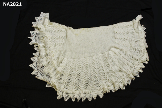 Hand knitted cream wool shawl. 