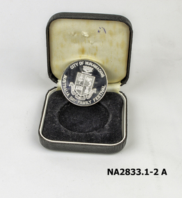 Silver coloured medal embossed with Nunawading crest 
