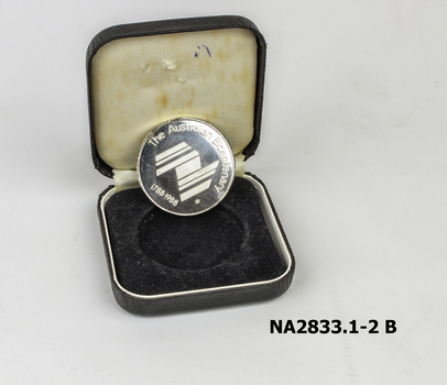 Silver coloured medal embossed with Nunawading crest 