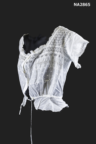 Bust bodice with square lace yoke with short sleeves that are lace edged with four buttons down front.