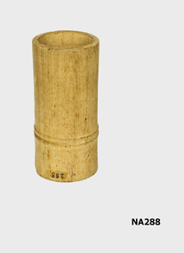 Wooden cylinder in which dice were placed and then thrown to score.