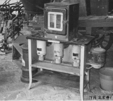 Unit consists of a base with three large adjustable kerosene burners under a grid on which pots and pans were placed.