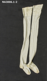 Pair of cream fully fashioned stockings in fine lisle with double thickness in soles and tops and a fine centre back seam.