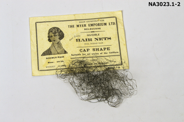 A ladies hair net made from human hair, colour grey. I
