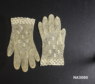 Ecru cotton mesh elbow - length gloves with design on back of hands.
