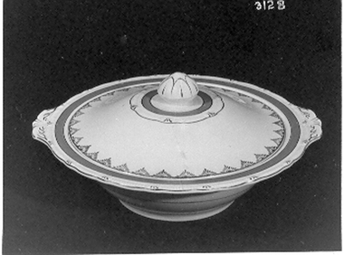 Round white casserole dish with handles and a matching lid. 