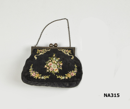 Black silk bag with yellow silk lining.