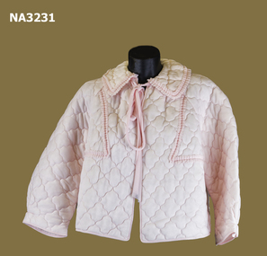 Quilted bed jacket, pink nylon; raglan sleeves.