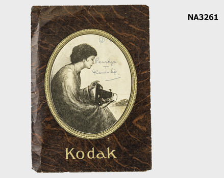 Brown cardboard folder, cameo picture at centre
