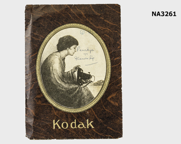 Brown cardboard folder, cameo picture at centre