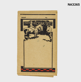 Black and beige paper folder to hold developed prints and negatives, stitching at top and base edges. 