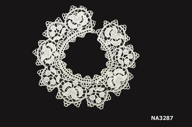 White, handmade needle lace collar for female dress.