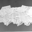 Creamy-white, fine voile baby's dress.