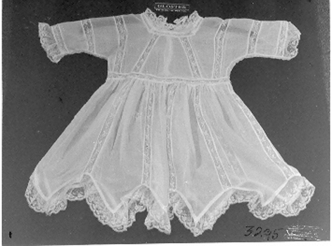 Creamy-white, fine voile baby's dress.