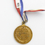 Gold plated embossed medal 