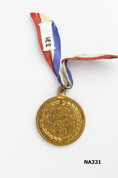 Gold plated embossed medal 