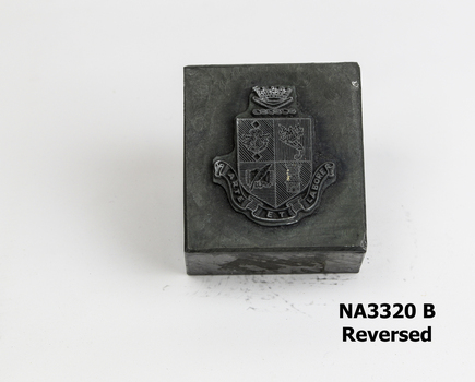 Metal block with City of Nunawading Coat of Arms at centre