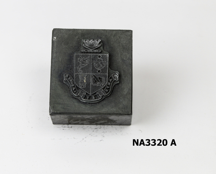 Metal block with City of Nunawading Coat of Arms at centre