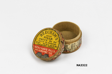Round wooden pill box.
