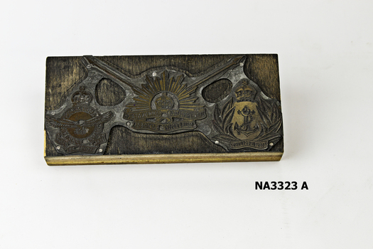  Oblong wooden block to which metal plate nailed. 