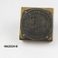 Square wooden block on which round metal plate nailed; 