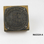 Square wooden block on which round metal plate nailed; 