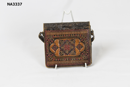 Small handbag with tooled coloured front: