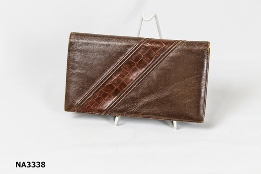Brown leather clutch handbag. 