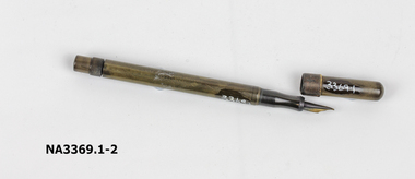Brown bakelite self-filling fountain pen; metal and bakelite nib.