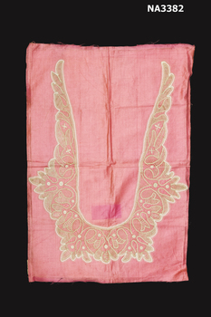 A Victorian Battenberg Lace collar in two tones of ecru. It is mounted on to pink polished cotton with paper backing