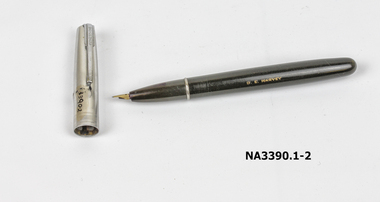 A black fountain pen with silver cap with silver filling lever 