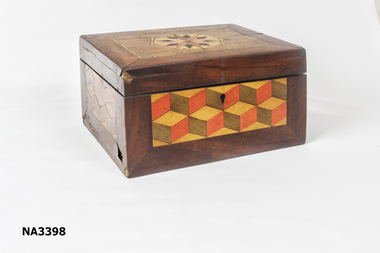 Square wooden box with inlaid wood design on lid and sides. 