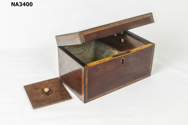 Polished wooden tea caddy. Inlaid border around lid and around all edges. 