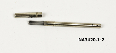 A small metal case, cylindrical, containing pencil leads, 